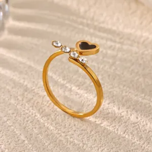 Gold stainless steel open ring with sparkling cubic zirconia and black heart detail everyday chic.