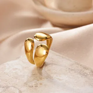 Close-up of a stylish 18k gold plated stainless steel open ring with modern teardrop design.