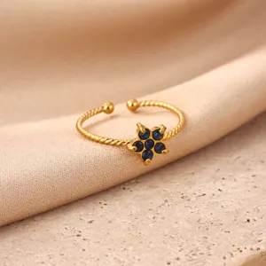 Gold plated stainless steel open ring featuring a charming blue stone flower design for women.