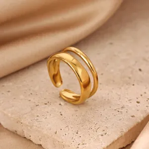 Minimalist stainless steel 18k gold plated double band open ring, elegant geometric design.