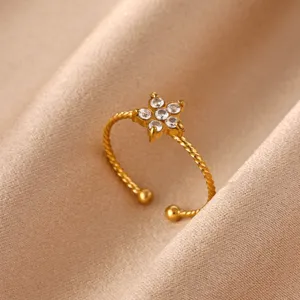 Close-up detail of the 18K gold plated stainless steel cubic zirconia flower open ring.