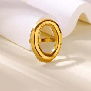 Close-up detail of the gold geometric open ring, showcasing the smooth metallic texture.