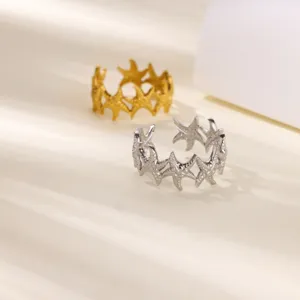 Detailed view of trendy geometric starfish open ring, dual-color gold and silver stainless steel.