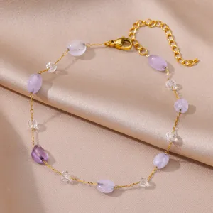 Exquisite gold plated stainless steel anklet featuring purple beads and clear crystals for women.