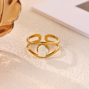 Exquisite detail shot of gold plated stainless steel open ring with a chic white flower.