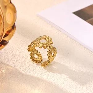 Close-up detail of stainless steel gold-plated sunflower open ring, showing delicate floral texture.