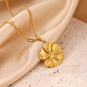 Close-up view of the golden flower pendant necklace showcasing detailed petals and stylish chains.