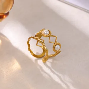 Elegant stainless steel 18k gold plated open ring with pearls and geometric cutout details.