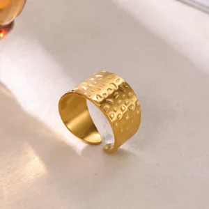 Wide hammered open ring in 18K gold plated stainless steel, stylish fashion jewelry detail.