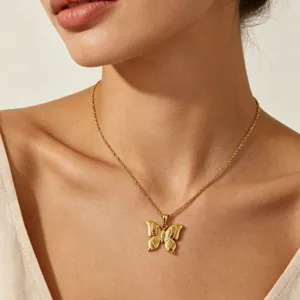 Exquisite gold butterfly pendant necklace in 18k gold plated stainless steel, elegant detail view.