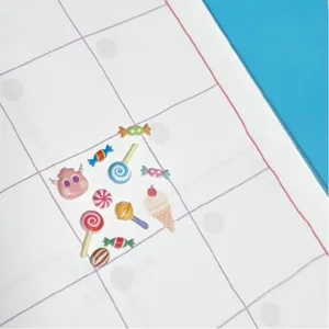 Detailed close-up shot of cute candy and little monster planner stickers for DIY journal decor.