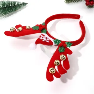 Christmas reindeer antler headband detail with jingle bells, santa hat and cute holiday design