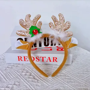 Christmas reindeer antler headband with gold sequins, white faux fur and red bell for holiday.