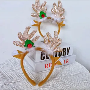 Christmas reindeer antler headband with sequins, plush and cute bell detail for holiday party.