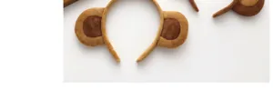Plush monkey ear headband detail view, soft and cute hair accessory for daily wear.