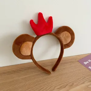 Cute plush monkey ear headband with red crown detail, perfect detail shot for everyday wear.