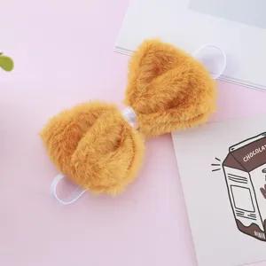 Cute yellow plush bow headband hair accessory with elastic band for cute styling.