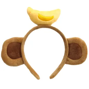 Cute plush monkey ear headband with banana decor, soft winter cartoon hair hoop for girls.