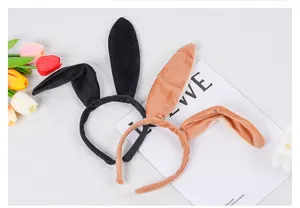 Plush bunny ear headband detail view, oversized soft velvet rabbit ears in black and brown.