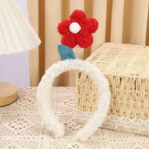 Cute plush flower headband detail, featuring soft lamb wool and a vibrant red floral design.