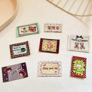 Cute cartoon bear and rabbit woven labels, ideal for DIY handmade clothing and hat decoration details.