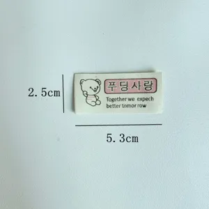 Close-up view of cute bear cloth label detail for handmade sewing DIY apparel accessories