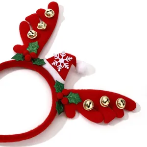 Close-up of Christmas reindeer antler headband featuring red velvet, jingle bells, and cute snowflake.