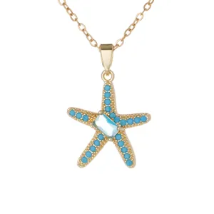 Collier pendentif étoile de mer doré avec perles turquoise et cristal central pour femme.
