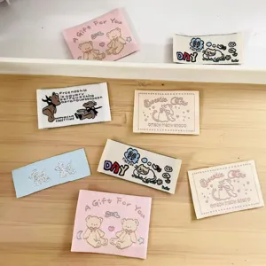 Cute cartoon woven fabric labels for DIY clothing, bags and handmade decorative patches details.