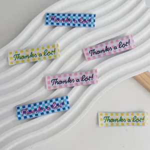 Colorful checkered embroidered fabric labels, DIY sewing tags for clothing, hats and bags.
