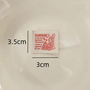 Detail shot of cotton printed label cloth, sewing DIY accessory, handmade clothing decoration patch.