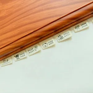 Handmade cotton fabric labels DIY accessories with cute animal patterns for clothing crafts.