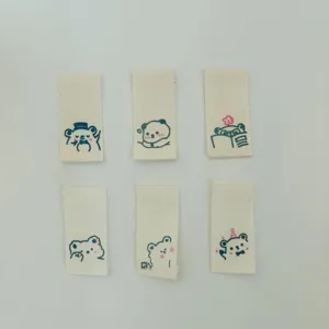 Close up of cute little bear cotton fabric labels, ideal for handmade garments and accessories.