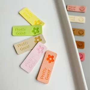 Colorful suede DIY flower sewing labels, detail shot of decorative patches for hats and bags.
