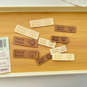 Cute DIY leather labels with bear and smiley face, perfect for hats, scarves and bags.
