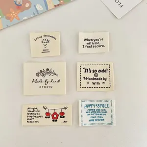 Cotton fabric labels set with cute English text prints, perfect for handmade DIY clothing, doll clothes, and accessories.