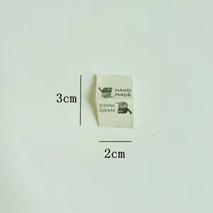 Handmade cotton clothing label with cute cat pattern, DIY sewing patch accessory, 3x2cm.