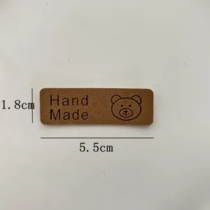 Brown PU leather handmade label tag with cute bear pattern, 5.5x1.8cm for DIY crafts hat bag.
