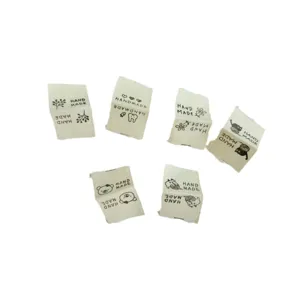 Handmade cotton fabric labels DIY sewing tags with cute bear and cat designs for clothing.