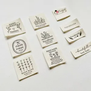 Cotton handmade fabric labels for clothing sewing accessories, DIY craft tags with cute designs.
