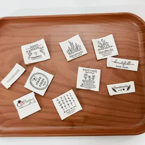 Pure cotton handmade clothing labels with cute floral prints and English text for DIY sewing.