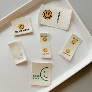 Cotton handmade smiley woven labels, side tags for clothing, bags, and socks accessories.