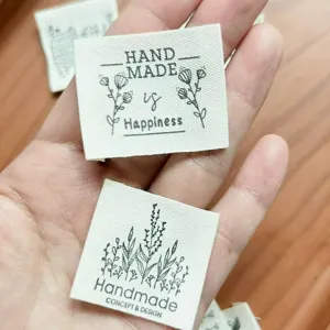 Handmade cotton fabric labels with floral design, perfect for clothing, scarves and DIY.