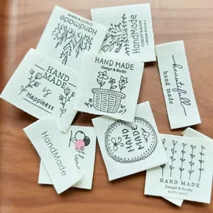 Pure cotton handmade fabric labels with cute floral prints and text, perfect for clothing DIY.