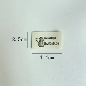 Handmade cloth label garment accessory DIY sewing badge with cute birdcage design and text.