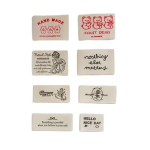 Handmade cotton fabric labels for clothing, bags, and hats with cute printed designs.