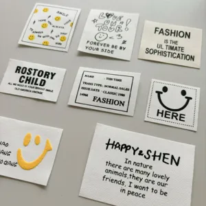 Decorative clothing fabric labels with trendy English letters and cute smiley face designs.