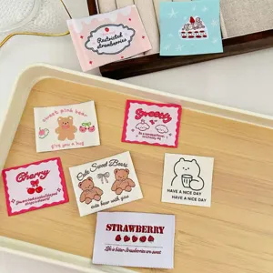 Close up of cute Korean style embroidered fabric labels, perfect for DIY crafts and accessories.