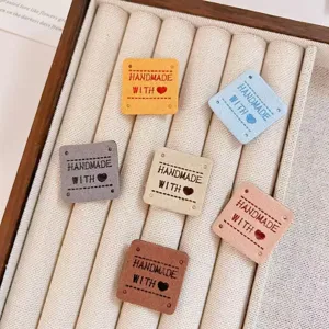 Handmade suede leather labels tags with embossed letters for clothing hats DIY crafts