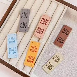 Colorful suede handmade leather labels with heart embossing for DIY hats, doll clothes and hair crafts.
